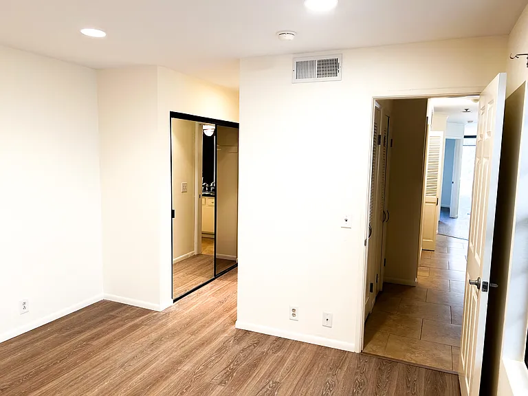 Second bedroom into hallway and into second bathroom