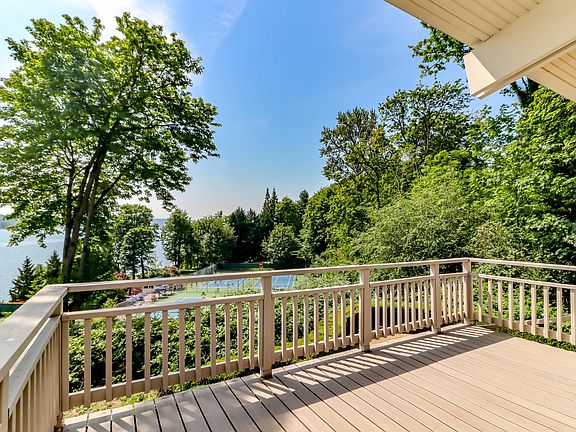 Main deck off kitchen and family room with sweeping views, including front-row sight lines to the Beach Club tennis courts_private yet connected to the action.