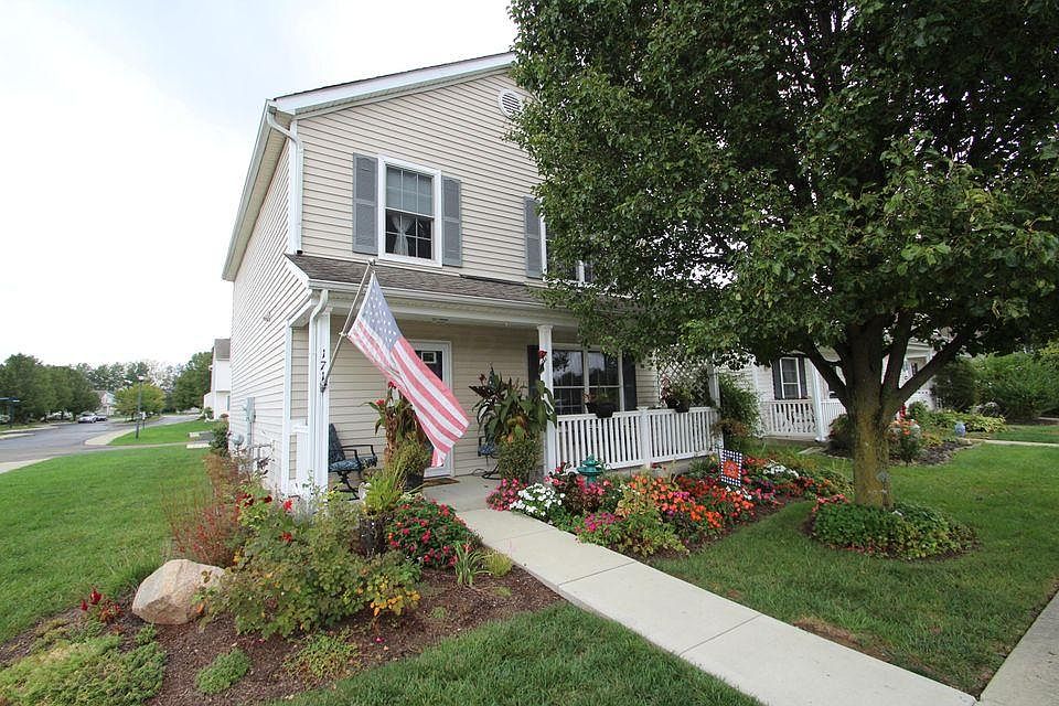 Corner lot with beautiful perennial flower beds. 2 Car detached garage with large patio and outdoor entertaining space.