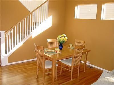 Formal dining area takes advantage of open floor plan. Oak hardwood flooring.