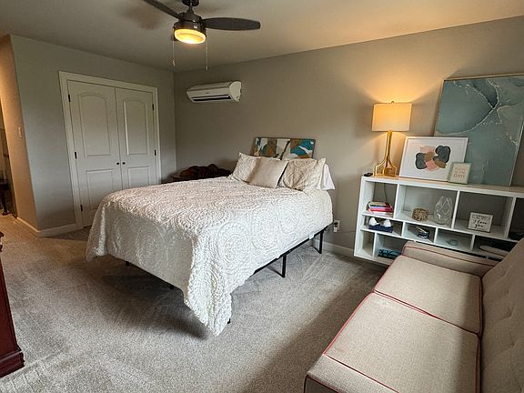 Main living area with Queen bed, full size sofa bed, mini-split, closet, and soon to be 42" smart TV on dresser.