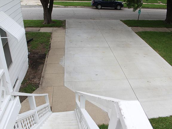 New, large concrete slab for parking.