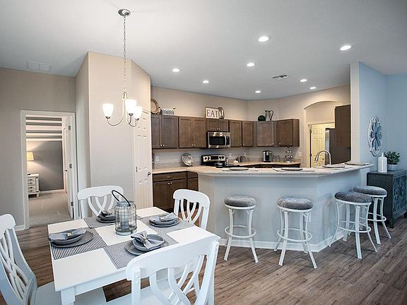 Enjoy a spacious and open living area - Photos from a home with similar finishes, not the actual hom