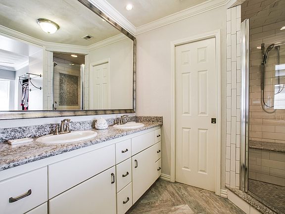 Granite master sink top, granite shower seat and granite curb in shower plus huge folding/dressing table (not shown) Custom Herringbone patterned floors in sink room and the shower. This is a totally reconfigured master wing created out of what was two be