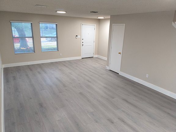 View of Foyer and Living Area from Dining Area