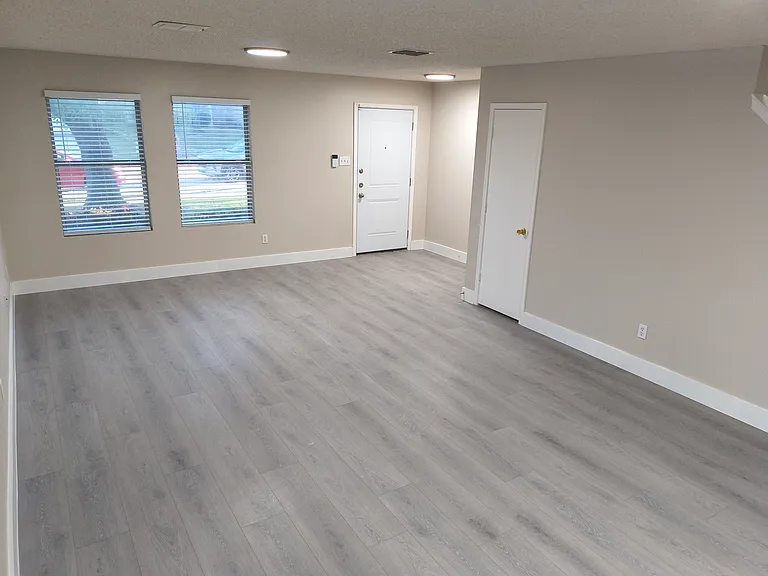 View of Foyer and Living Area from Dining Area