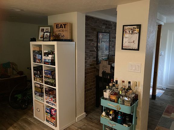 Additional photo of entry area with brick wall