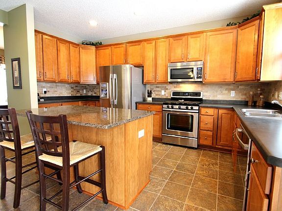 Another view of the gorgeous kitchen area and Travertine stone Backsplash.