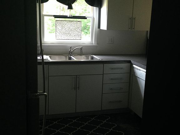 side entrance view of kitchen. this entrance has 6x8 deck