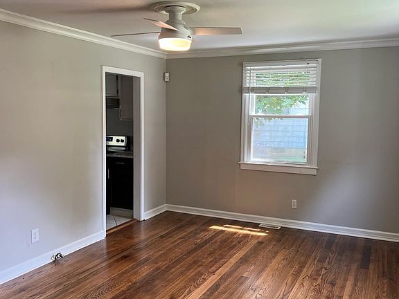 Living Room - bright and spacious with a ceiling fan