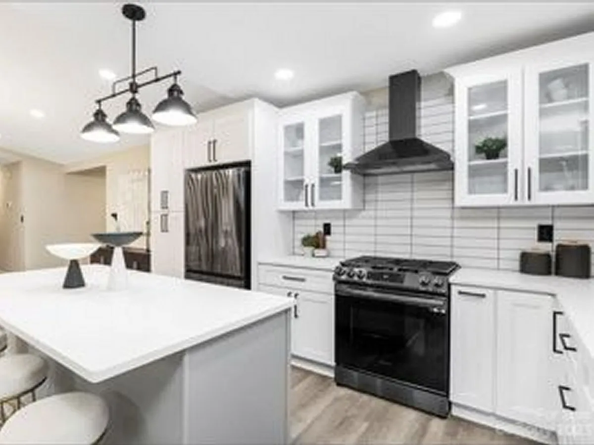 big beautiful kitchen with modern appliances, glass-front cabinets, and kitchen island - 11015 Vista Haven Dr