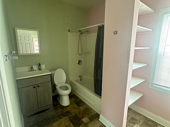 Large bathroom with Vanity and storage space