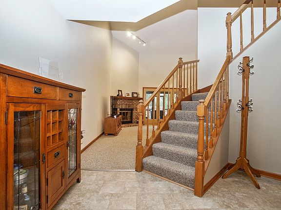 Open foyer with newer ceramic tile floors