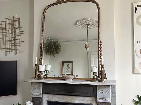Functioning wood-burning fireplace in living room