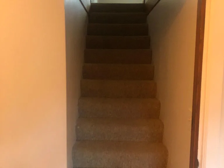 Stairs to upstairs bedroom