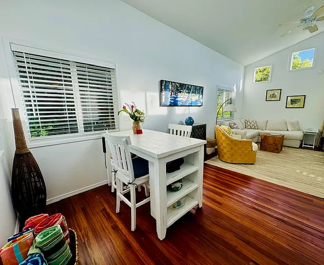 Eating table with seating for four. Note beautiful red Mahogony flooring.