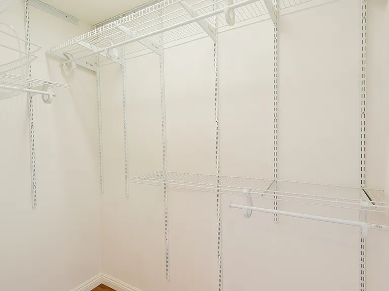 Primary bedroom walking closet
