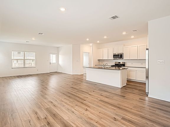 Open concept living, dining and kitchen