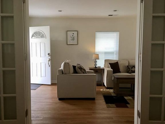 A view from the master bedroom to the living room and front door.
