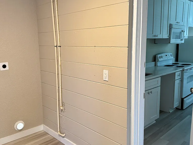 Laundry room opens into kitchen