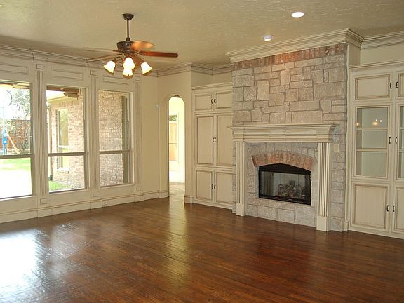 kitchen is open to family room and family room looks out to large backyard