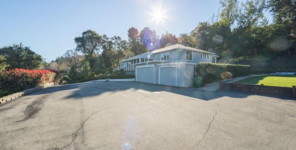 Front of home with exrta large driveway