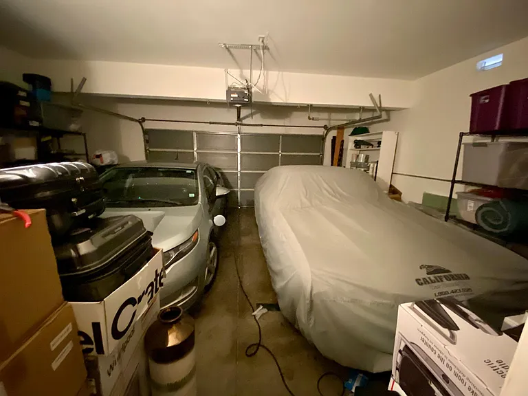 Two car garage with EV charger.