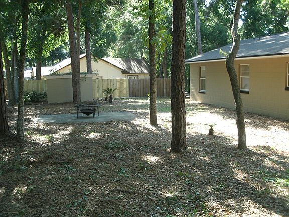 Back yard with patio deck or basketball pad