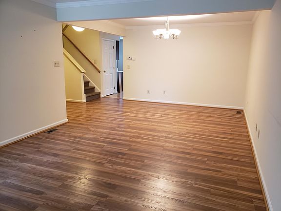 Living + Dining Rooms with new hardwood flooring