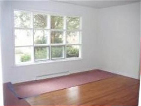 Living Room Hardwood Floor and Picture Window