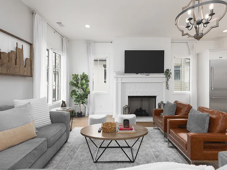 Cozy living room with comfortable seating, a fireplace and a Smart TV.