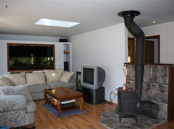 LIVING ROOM W/ WOOD BURNING STOVE