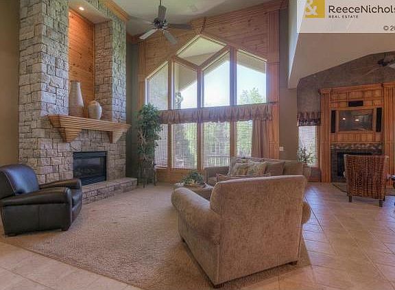 Spacious great room boasts 20' ceilings, a wall of windows with
