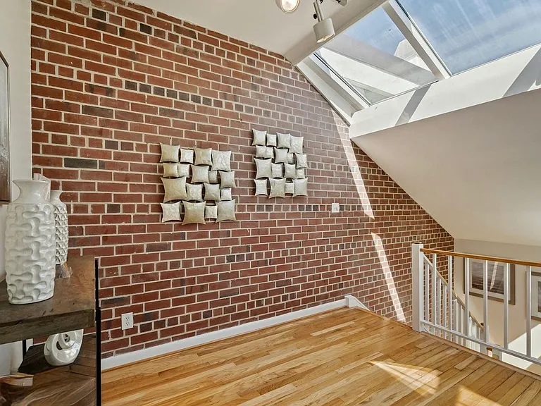 Living room entrance from the stairs, skylight