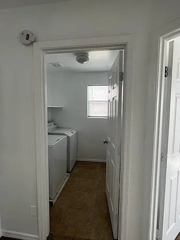 Laundry room with full size washer and dryer.