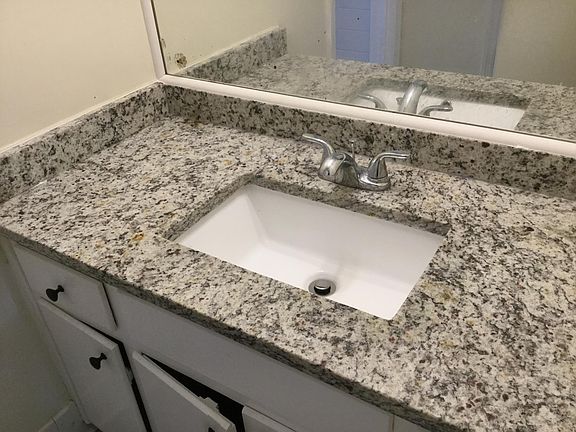 New granite vanity top in one bathroom