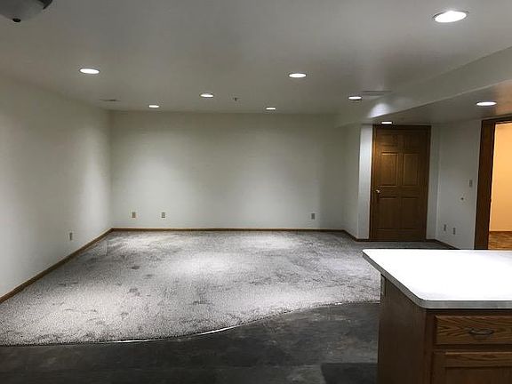 Living room with new carpet and interior has just been painted.