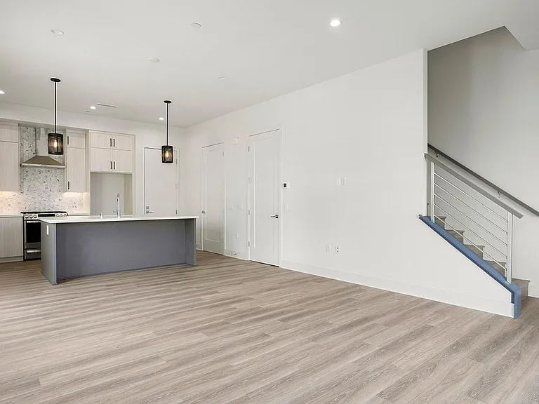 Downstairs living area with powder room off kitchen
