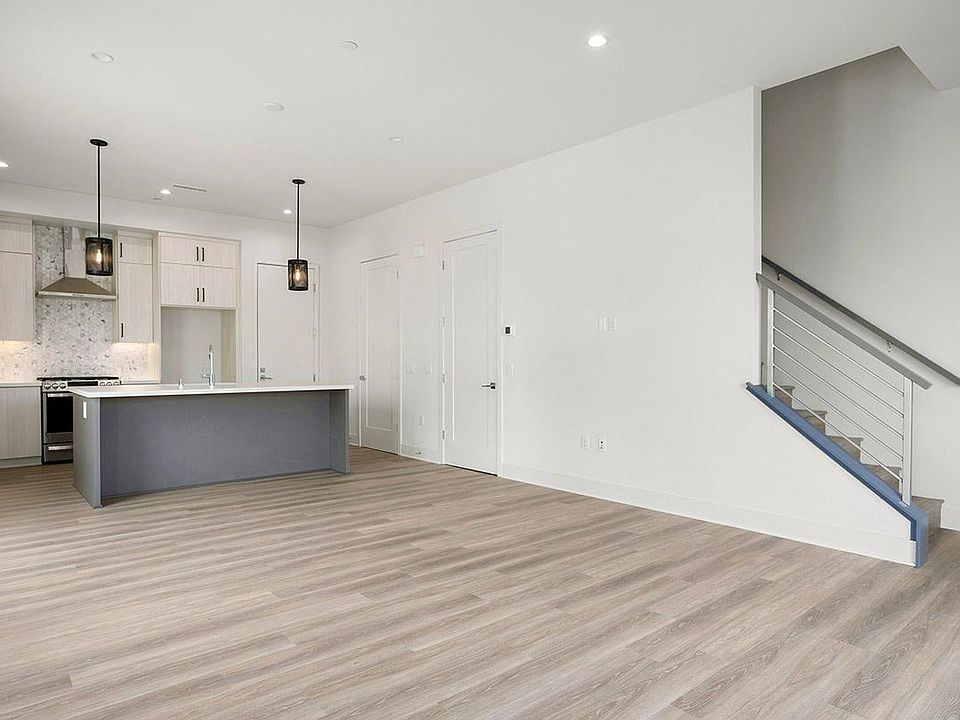 Downstairs living area with powder room off kitchen