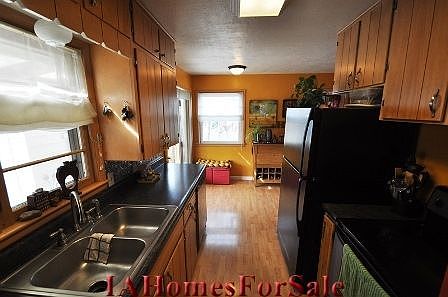 Kitchen - New flooring, counter, faucet and appliances in 2006. Room for a table for eat in kitchen as well. 