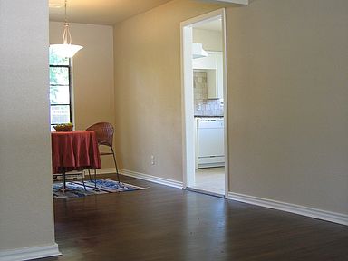 View of living room, dining room and entryway to kitchen