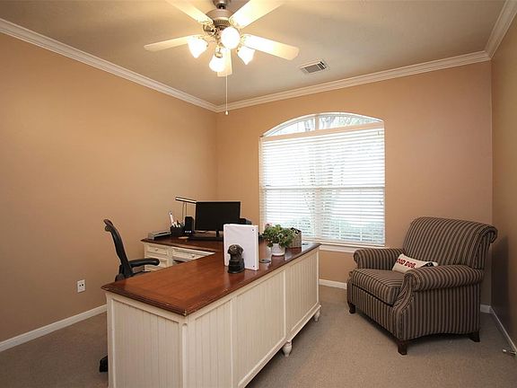 Executive study with French doors for added privacy.