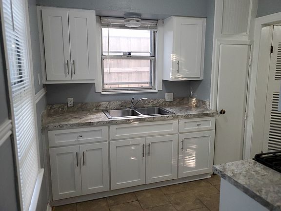 Kitchen also has a double door fridge.