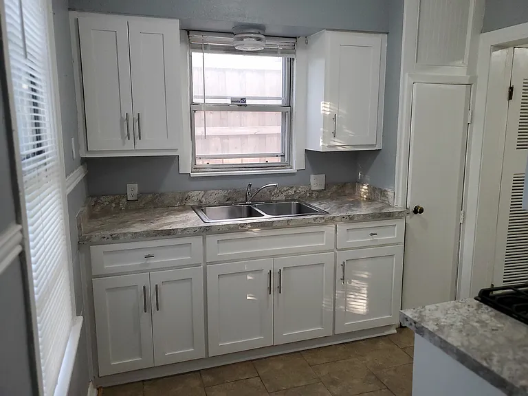 Kitchen also has a double door fridge.