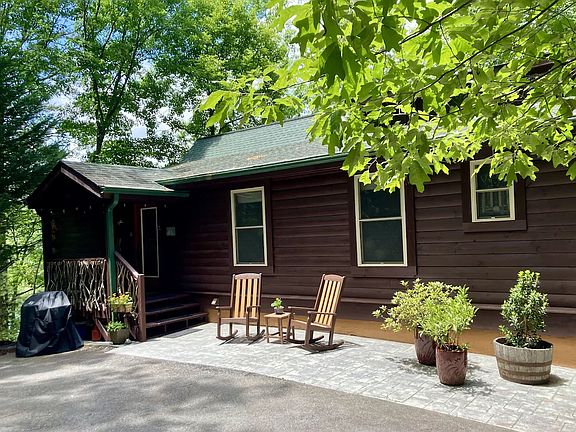 Cabin entrance. Outdoor gas grill.
