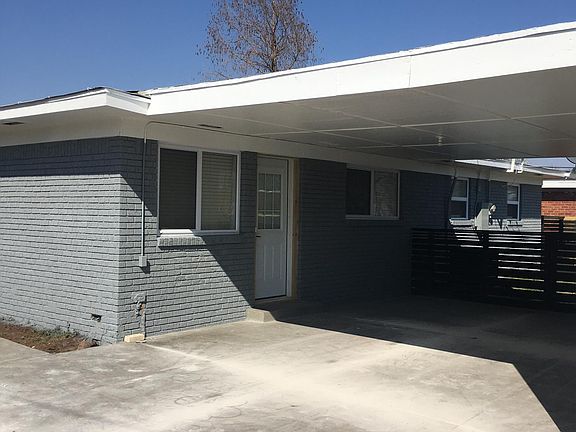 NEW 2 CAR DRIVE AND MID CENTURY CARPORT WITH STORAGE