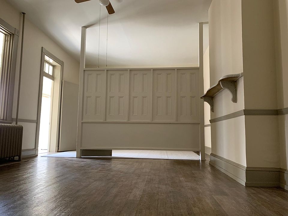 This would be the living room. The office space would be on the other side of the half wall.