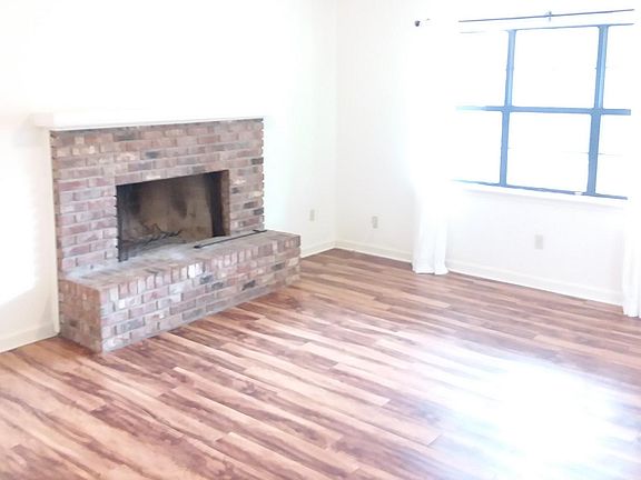 A view of the living room from the dining room, on a too sunny day