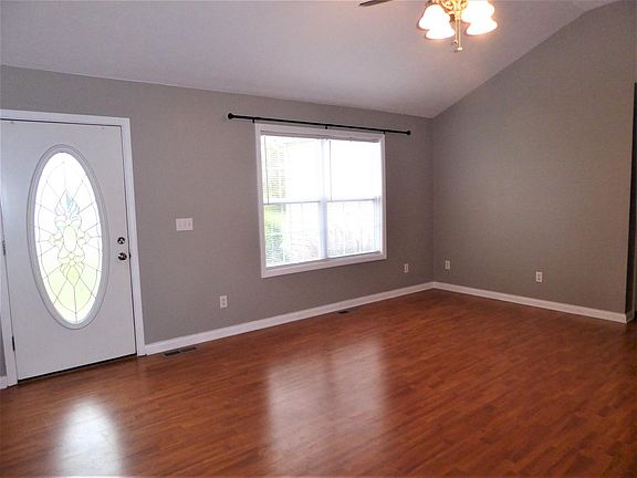 Front door opens to stylish, neutral colors and contemporary flooring throughout.