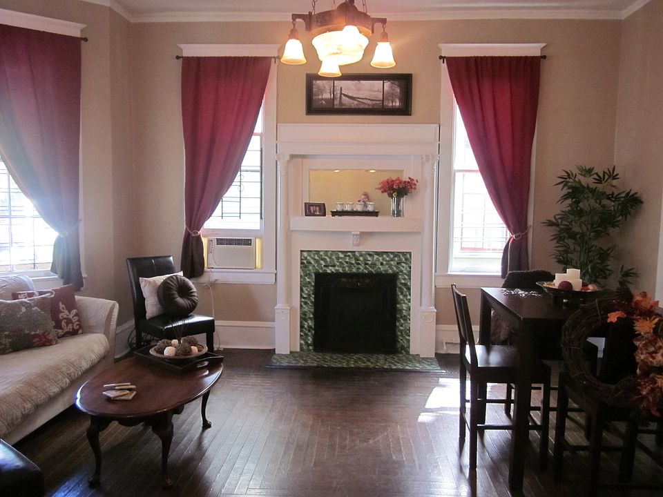 Living room/dining area with one of two fireplaces
olde worldecharm times two!